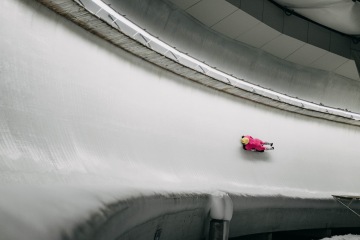 skeleton athlete with helmet on track
